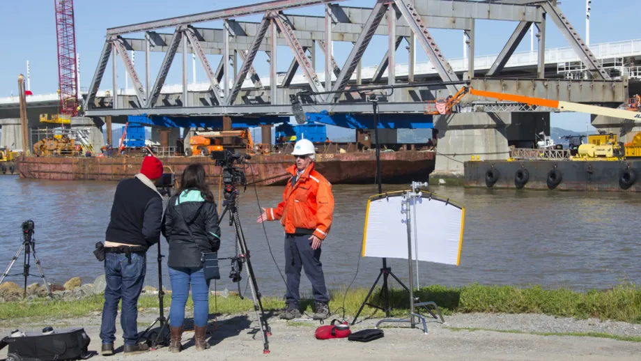 camera crew filming Truss being moved on a barge