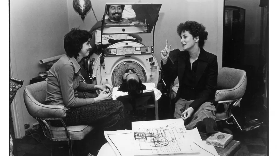 Cathy, Ed and Architect Sally Swanson decide how to renovate their new home so that the iron lung is the center of activity.