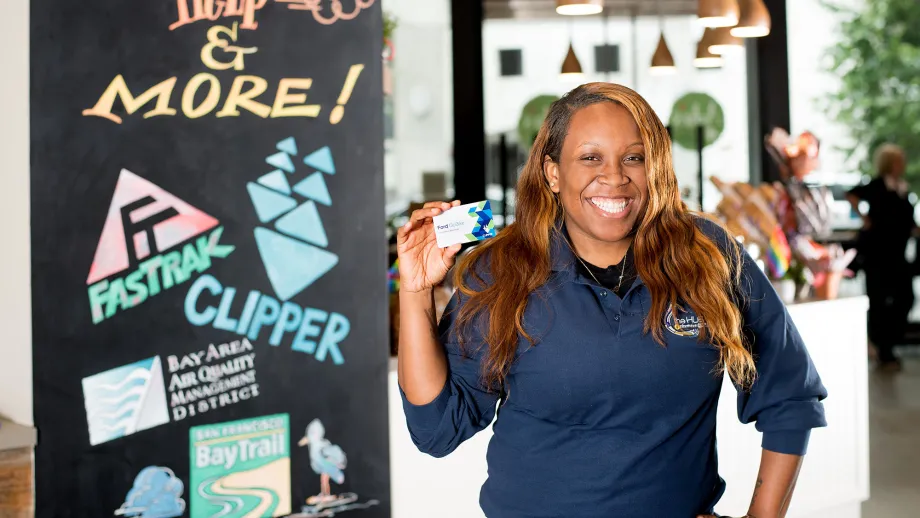 Woman holding a clipper card