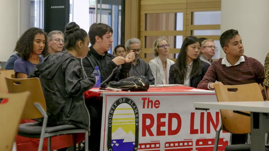 Group of people at a Red Line table