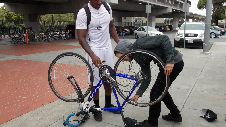 A commuter gets some tune up help at the Hayward BART station courtesy of Cyclepath Hayward.