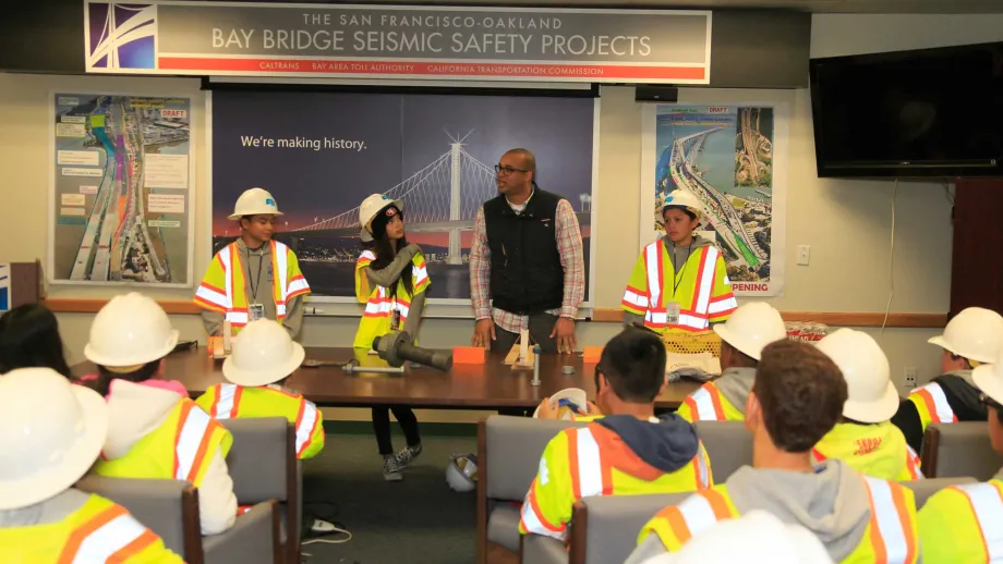 Public information officer Victor Gauthier quizzes the kids on Bay Bridge facts and figures.