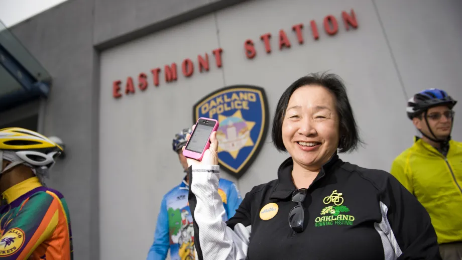 Oakland Mayor and MTC CommissionerJean Quan posts her bike to work day status to Facebook at the Eastmont Oakland Police Station. 